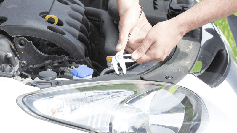Use a wrench to open and inspect the inside of the lamp