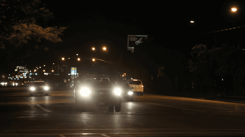 Turn on the low beams when the car is moving on the road