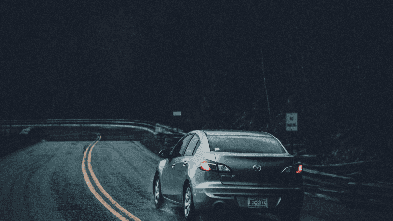 a car with working sidelights in a low-light condition