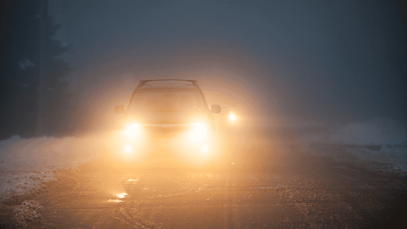 drive with fog lights on a snowy day