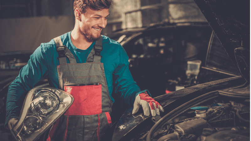 close-up of replacing headlight bulbs