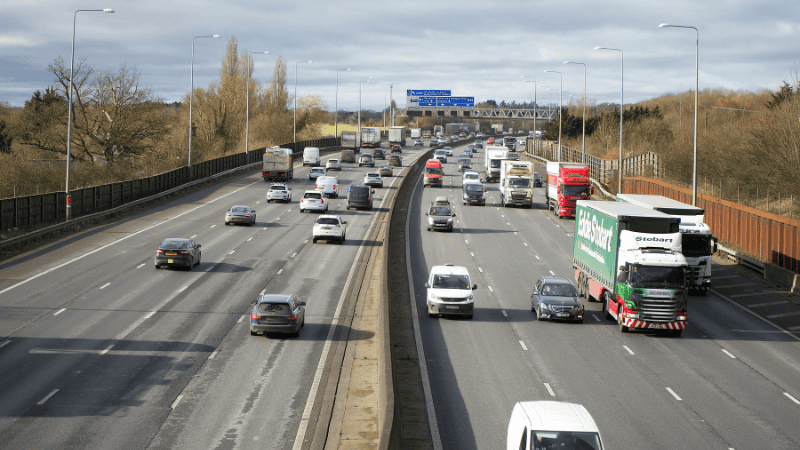 There are many cars running on the expressway