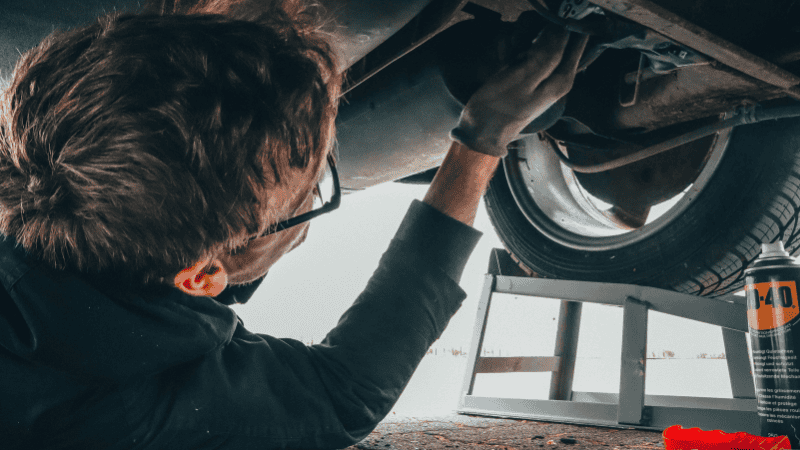 Medium shot man checking car