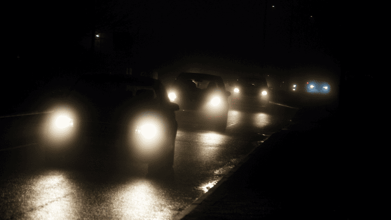 Vehicles on the road with their lights on