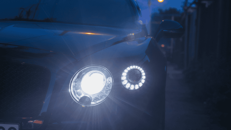 The headlights on the opposite side of the road give off a glare.