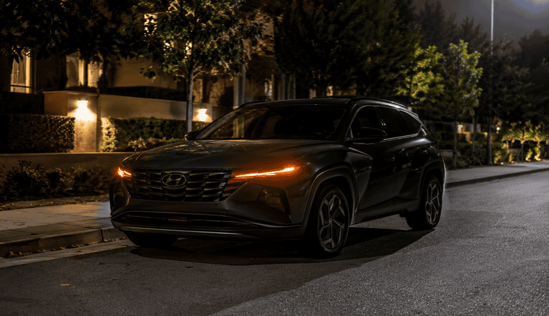 car parked at night with parking lights on