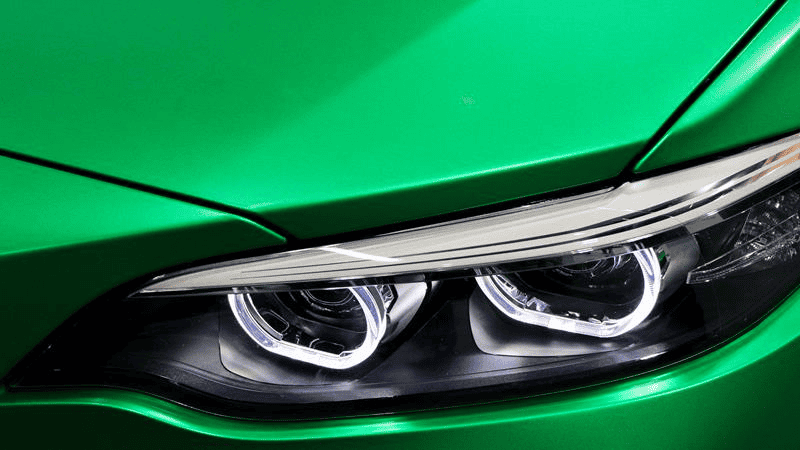 LED headlight on a green car.