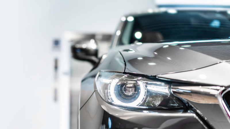 The picture shows a grey car with properly installed headlights.